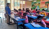 শিক্ষকদের অনুপস্থিতিতে পরীক্ষা নিলেন গ্রাম পুলিশ